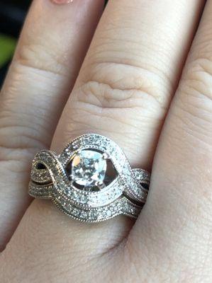 My beautifully redone ring. They replaced the center with a cushion cut diamond and it turned out amazing.