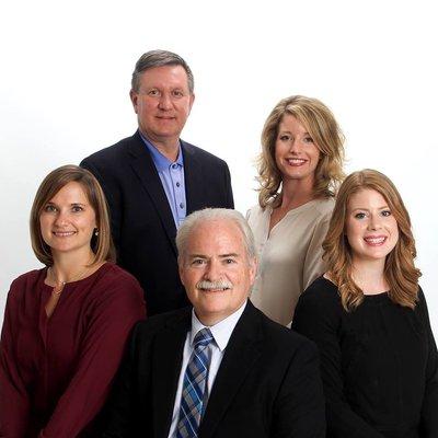 From left to right: Dr. Caity McCauley, Dr. Frank Celin (standing), Dr. Robert McCauley, Dr. Lindsay McCauley (standing), and Dr. Emily Dean