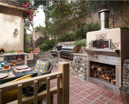 Outdoor kitchen with a wood fired pizza oven