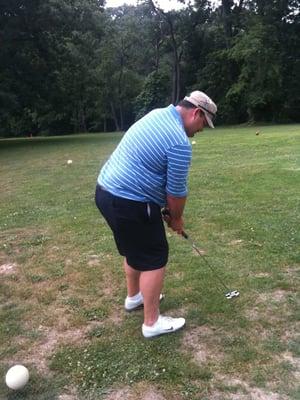 Dameon Adams, Berea Country Club member demonstrates a chip.