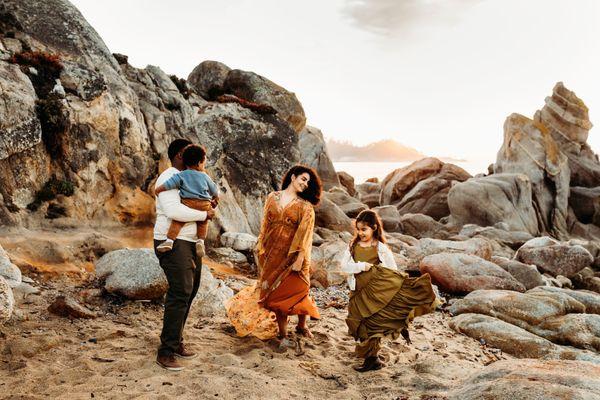 Family photo on a rocky beach in Carmel, CA