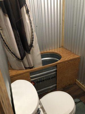 The tub is made out of a metal watering tub for livestock.