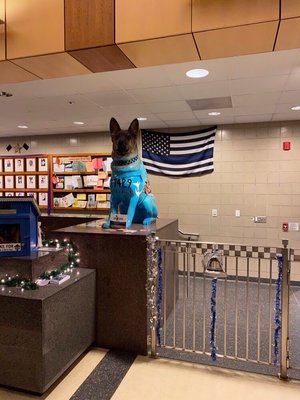 K-9 watching over the Little Free Library