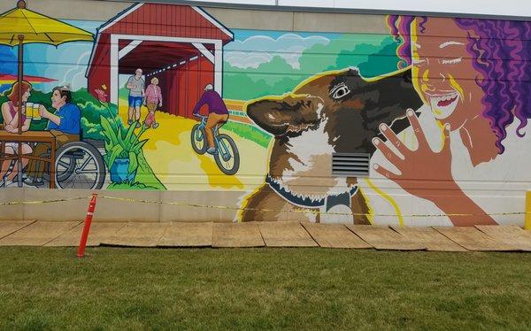 Part of the mural (located on the police garage) is a Memorial to fallen K-9 officer Harlej who was killed in the arrest of a suspect in2019