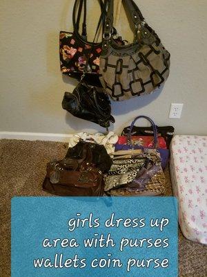 Girls make pretend/ dress up. We have costumes, purses, wallets