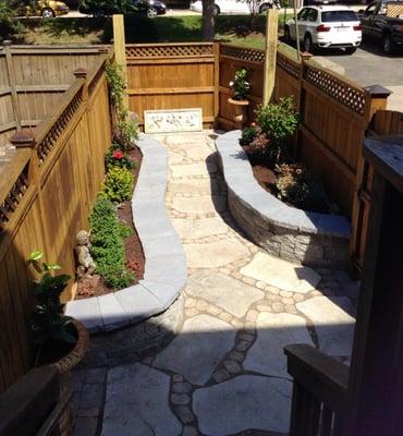 Town-home Custom built patio and seating plant beds .Landscapes By Wade Inc.