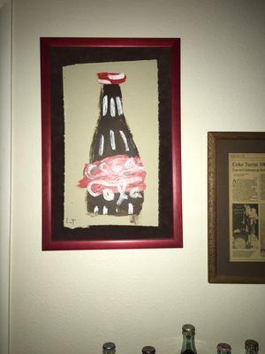 Coca Cola bottle painted on drywall