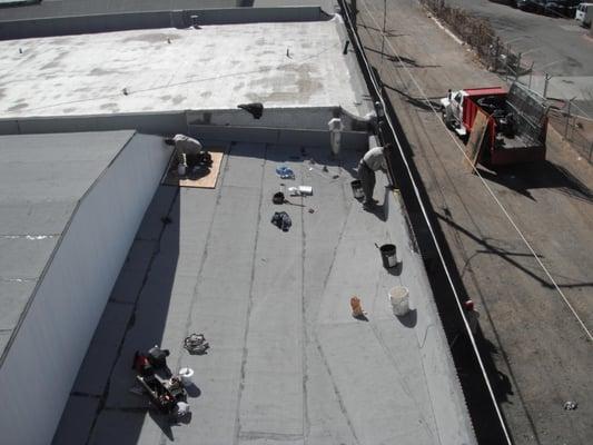 Last section of the roof almost completed. For this job we installed a Firestone brand rubber roof on a Firestone store.