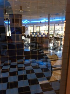 Checkered tiles and blue neon lights