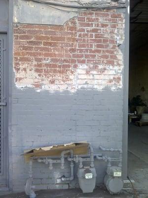 Sandblasting the paint off to expose the original Brick