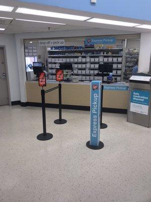 24hour Pharmacy has medicine disposal container and express lane line