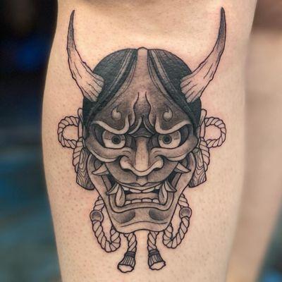 Hanya mask black and grey calf tattoo