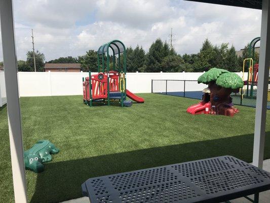 The synthetic turf playground for the younger children.