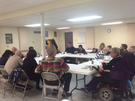 Corporate Prayer during our Potluck and Fellowship.