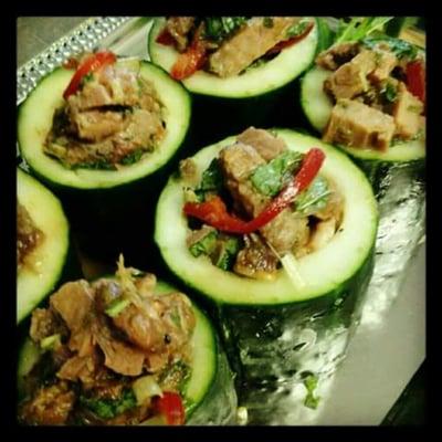 Thai beef salad in cucumber cups.