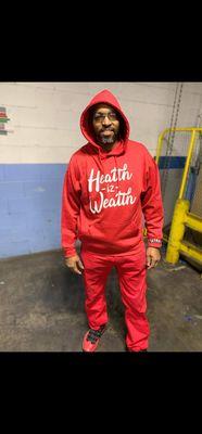 He's representing on the job in the "health iz wealth " hoodie. All mottos come in hoodies or tees.