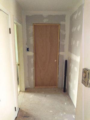 pre-hung door install, sheetrock with tape & spackle