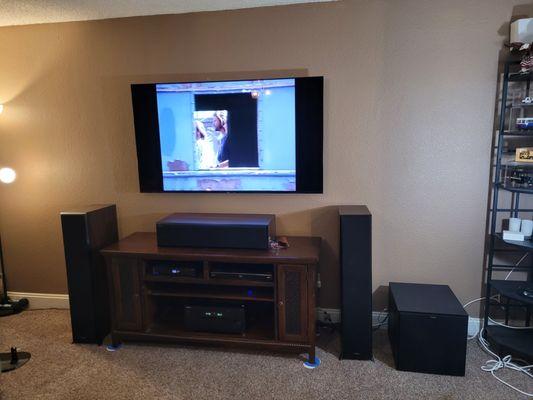 Check out this awesome home theater setup we just finished! With left, center, and right channel speakers and a powerful 12" sub.