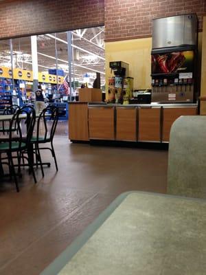 Interior restaurant. At entrance to Wal Mart. Check out area of Wal Mart visible just beyond restaurant.