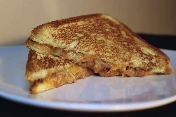 Our Pork N Cheese - grilled cheese sandwich, stuffed with BBQ pulled pork!