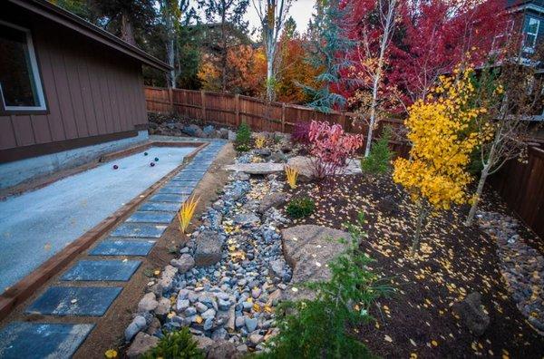 Bocce ball court, pondless water feature, plants, trees and more