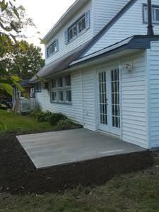 New back patio. Fresh top soil ready for grass