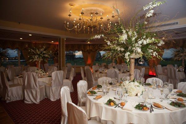 Dining & ballroom area with view of Manhattan in the distance. Floral arrangements by Stefans Florist. Photo by Silverfox Photography.