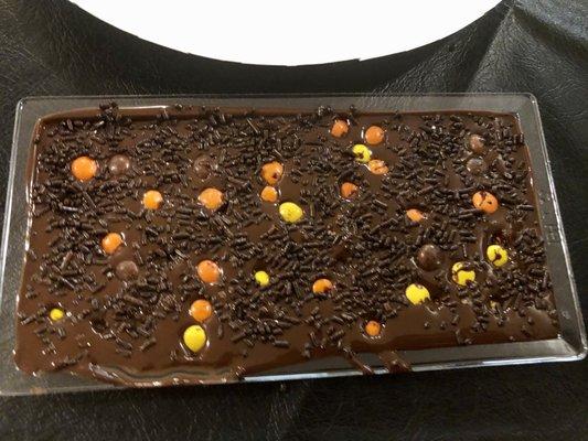 Dark chocolate with reeses and sprinkles.