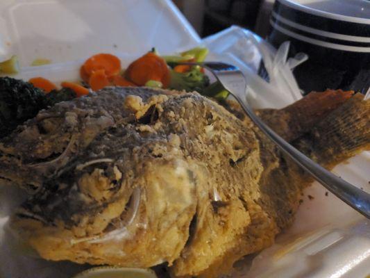 Fried whole tilapia  and veggies  Broccoli and carrots