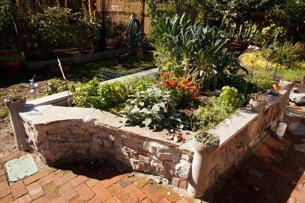 A medieval themed raised bed made with mortared stone.