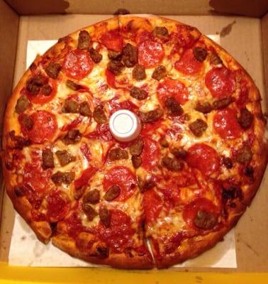 Medium thick-crust, extra sauce, pepperoni and sausage.