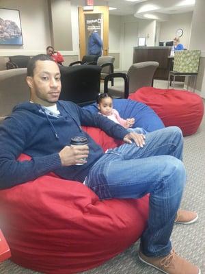 My husband and daughter relaxing on the cool beanbags in the waiting room waiting for me.