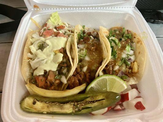 Fish taco on the left, Al pastor on the right