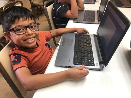 Working in the computer lab at the Super Kids Club.