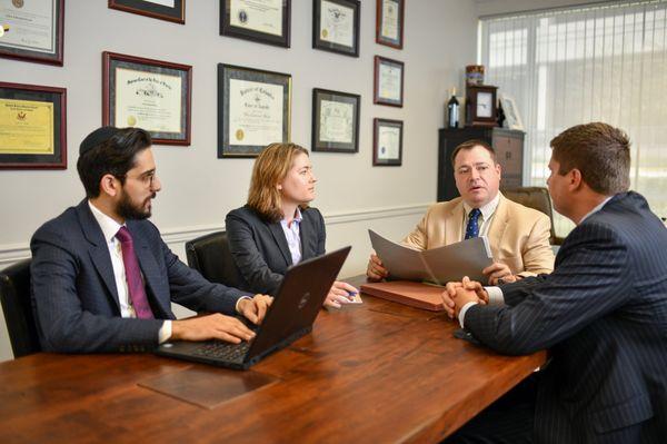 Leanne Broyles and Rob Owings, tax attorneys, discussing trust estate matters.