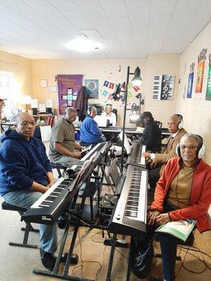 The Music Scene's senior group piano class. It's never too late to have fun playing the black & white keys. Come join us!