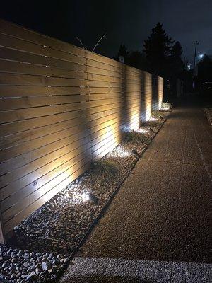 New fence with outdoor accent lighting