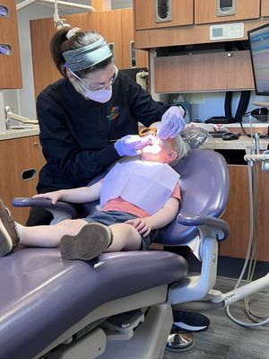 A very chill and happy toddler thanks to the staff at Dentistry for Children!