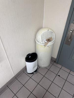 Overflowing trash can