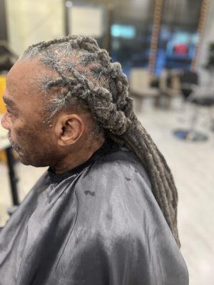 Braided locs that were washed and twisted .