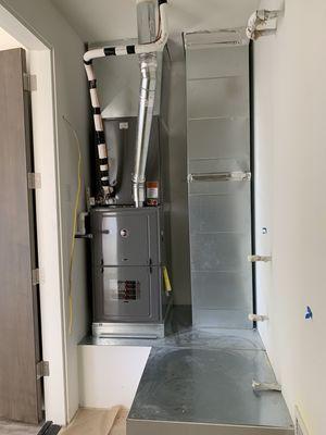 Natural gas furnace 80% efficiency installed in closet in semi custom house