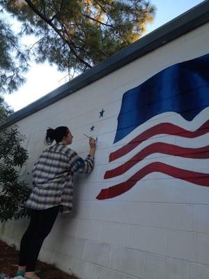 Mural being painted @american Classic self storage