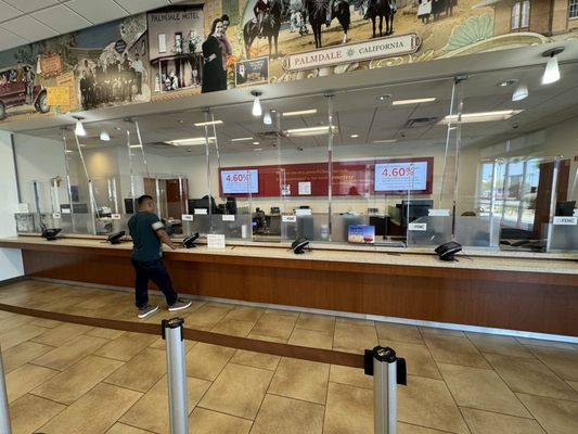 You get lucky there's only a couple people in line but there's only one teller so you still spend 30 minutes waiting.