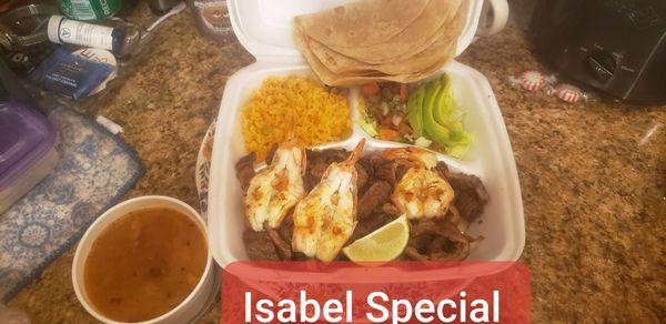 Isabel Special: Fajita & 3 Shrimp on a bed of grilled onions with Avocado, Pico de Gallo, Spanish Rice, Charro Beans and Tortillas.