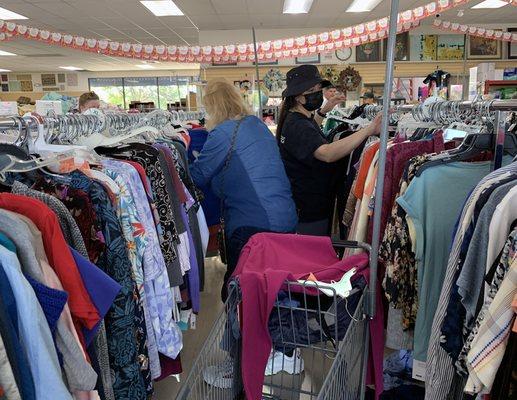 Customers shop for women's clothes at Community Hospice Hope Chest, Ceres on 6.14.23.