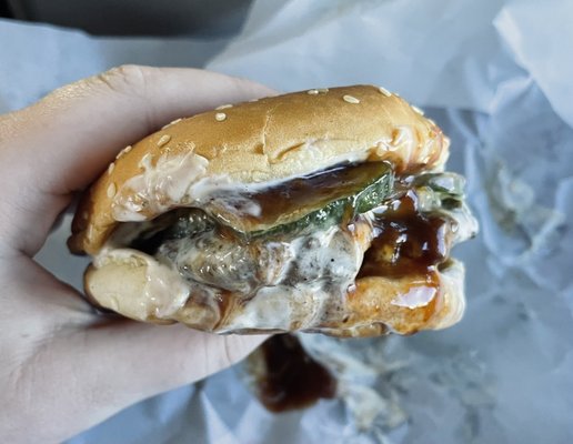 burger with bbq sauce, ranch, pickles, and pineapple.