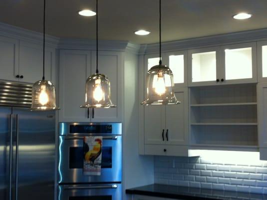 Kitchen remodel with led under cabinet lights and led in cans in the upper cabinets.