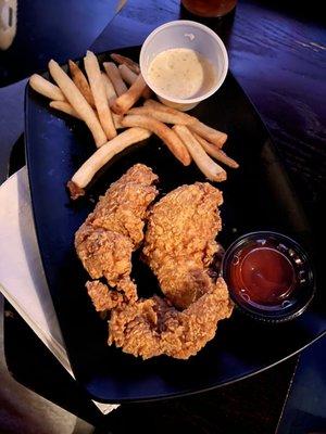 Hand breaded chicken tenders and fries ( he ate some of the fries)