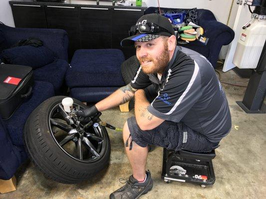 One of our ceramic coating experts applying IGL Wheel Ceramic Wheel Protection!