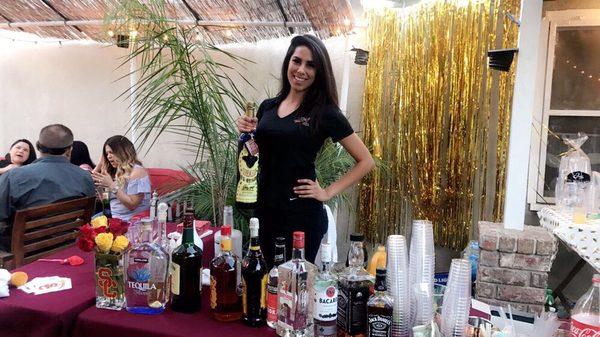 Ashley bartending a graduation party